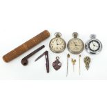 Objects including three Ingersoll pocket watches, three stick pins and a smoking pipe, the largest