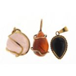 Three semi precious stone pendants including two 9ct gold, the largest 2cm high, 4.8g : For