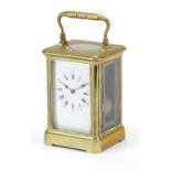 19th century brass cased carriage alarm clock with enamel dial having Roman and Arabic numerals,