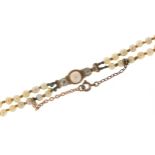 Two row graduated pearl necklace with diamond clasp, the largest pearl approximately 6.5mm in