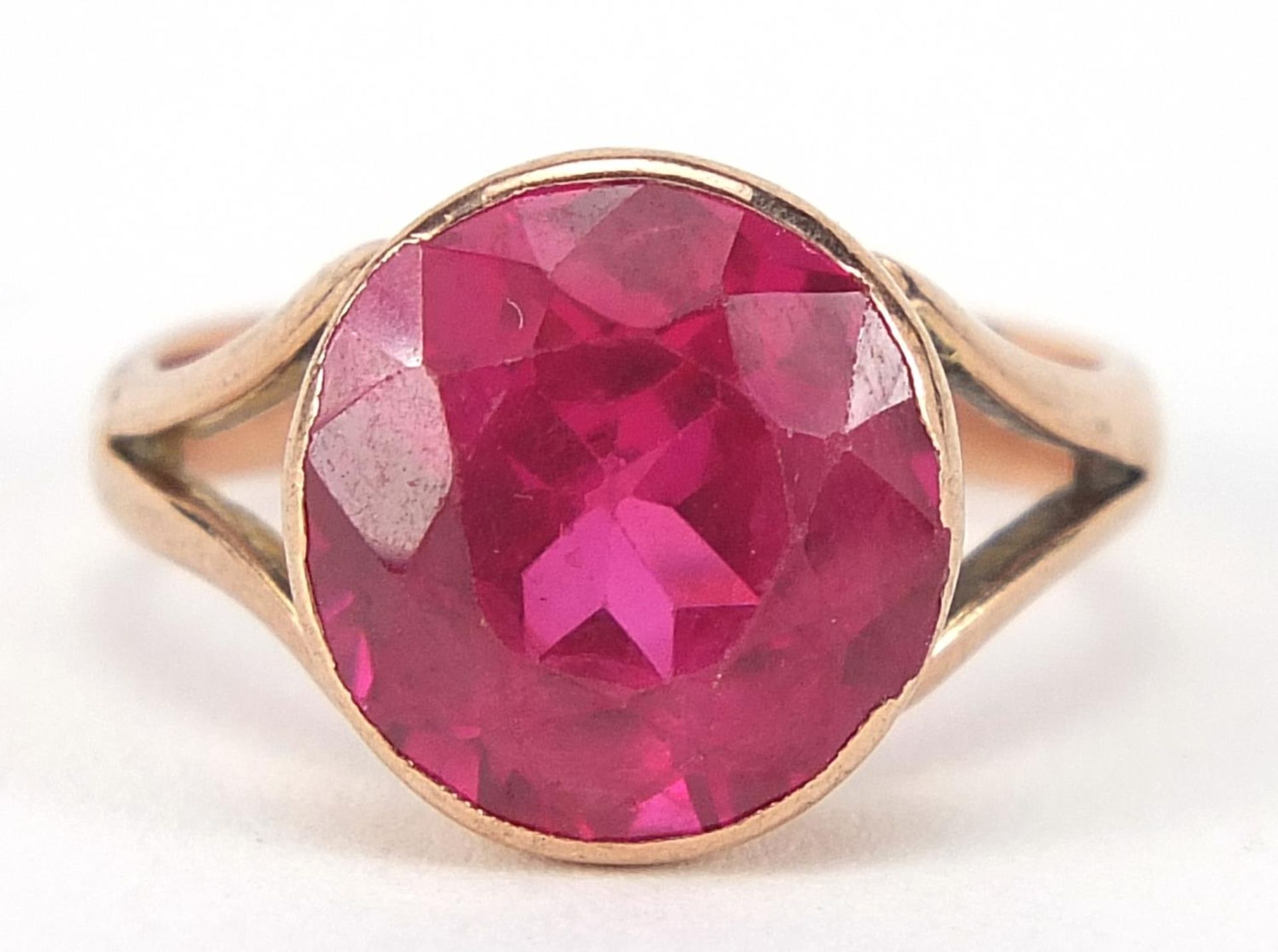 9ct rose gold ruby solitaire ring, the stone approximately 10mm in diameter, size H, 3.6g : For