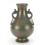 Japanese patinated bronze vase with animalia ring turned handles, impressed marks to the base, 24.