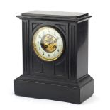 Victorian black slate mantle clock with visible brocot escapement and circular dial inscribed
