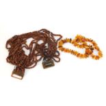 Butterscotch amber coloured bead necklace and a twelve row amber coloured necklace, total 244.2g :