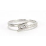 Platinum diamond three stone crossover ring, approximately 0.10 carat in total, size N, 2.8g : For