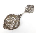 William Comyns & Sons, Victorian silver spoon pierced and embossed with mother with child and Putti,