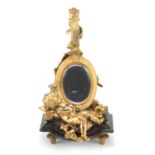 French Empire style gilt bronze table mirror in the form of Putti with a mandolin, raised on a