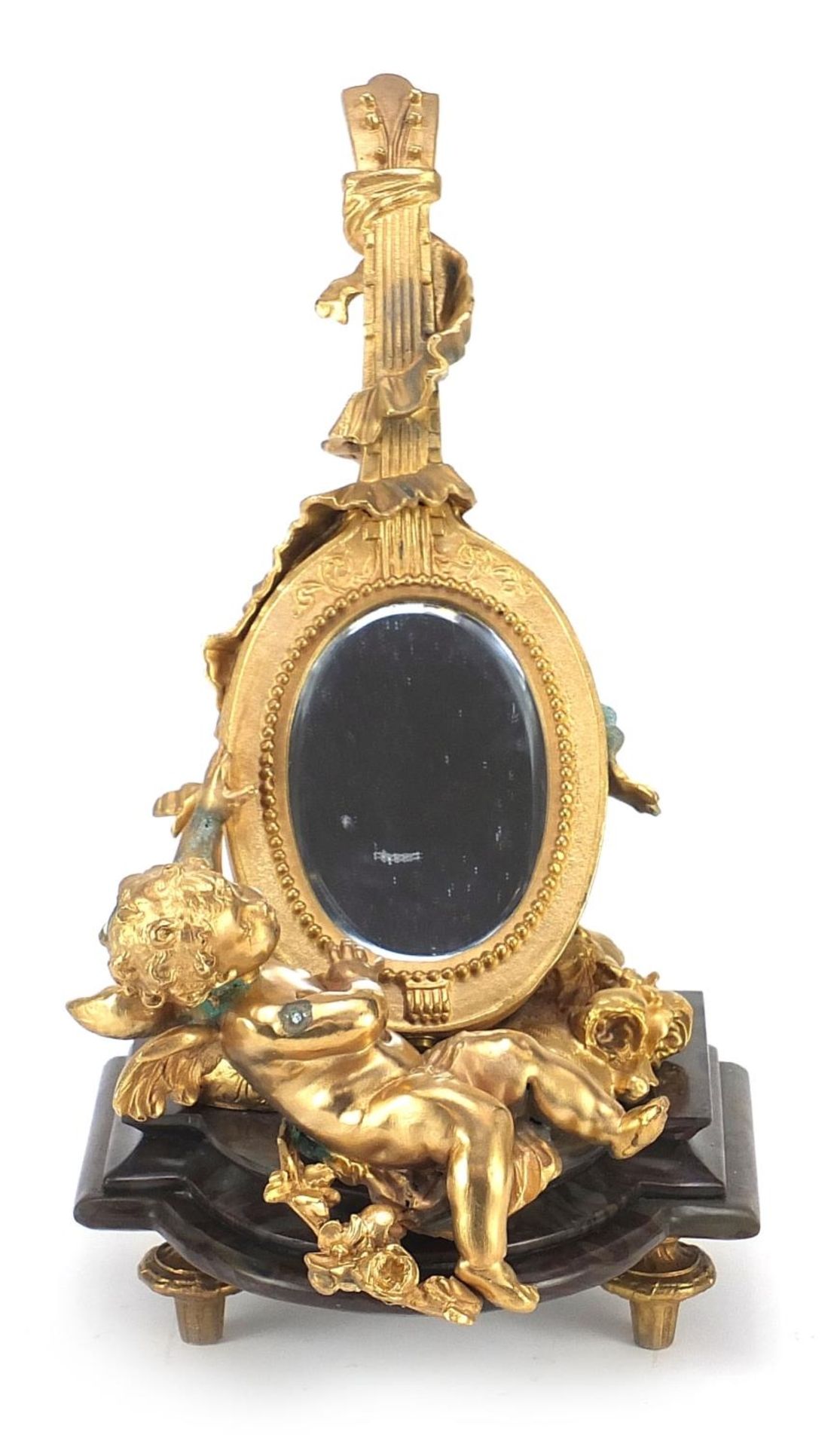French Empire style gilt bronze table mirror in the form of Putti with a mandolin, raised on a