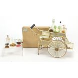 19th century German tinplate refreshment wagon with implements housed in a cardboard case