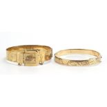 Two 9ct gold metal core hinged bangles including a belt buckle example, 32.0g : For Further