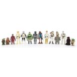 Fourteen vintage Star Wars action figures with accessories including Sand People, Snaggletooth,