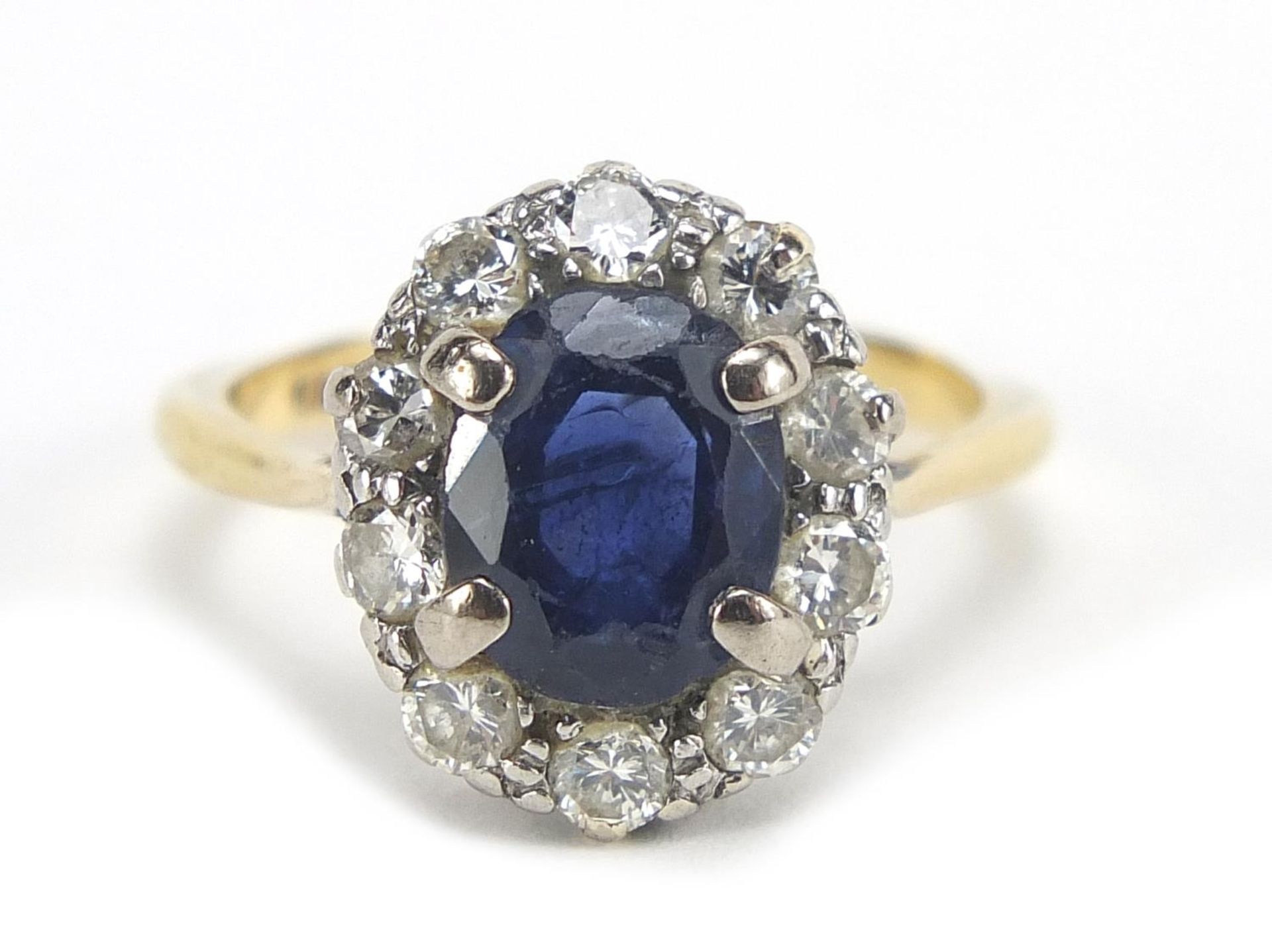 18ct gold sapphire and diamond ring, the sapphire approximately 8.5mm x 6.8mm, the diamonds