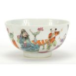 Chinese porcelain bowl hand painted in the famille rose palette with figures in a palace setting,