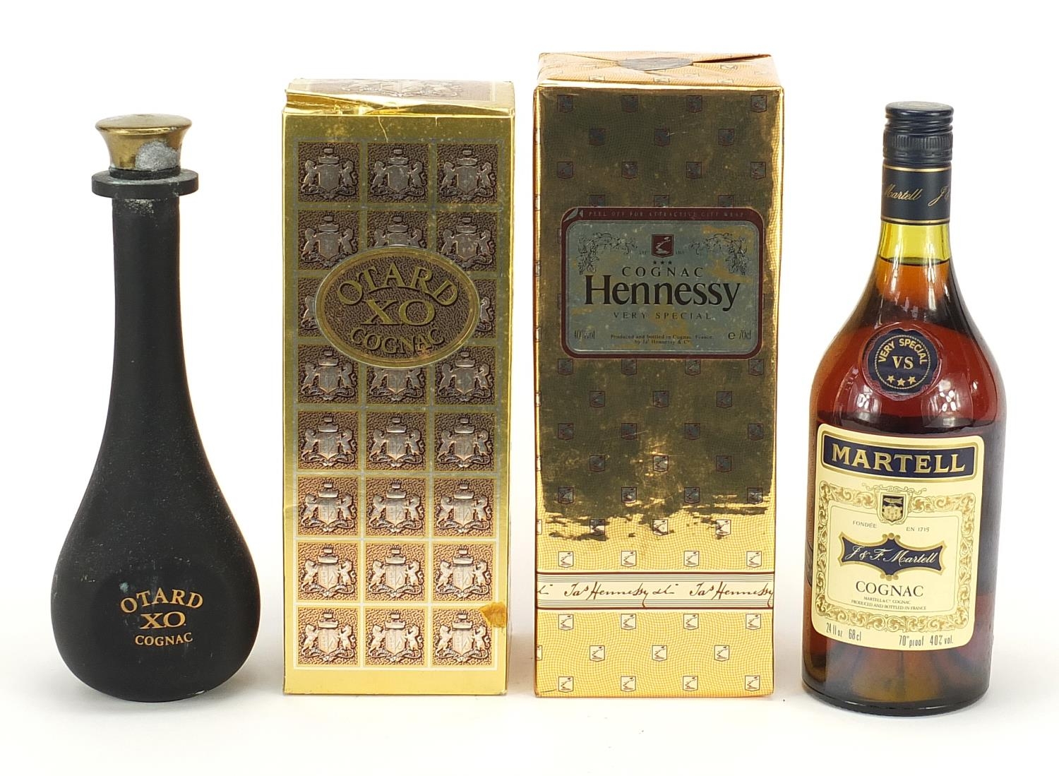 Three vintage bottles of cognac, two with boxes, one sealed, comprising Otard XO, Hennesey Very