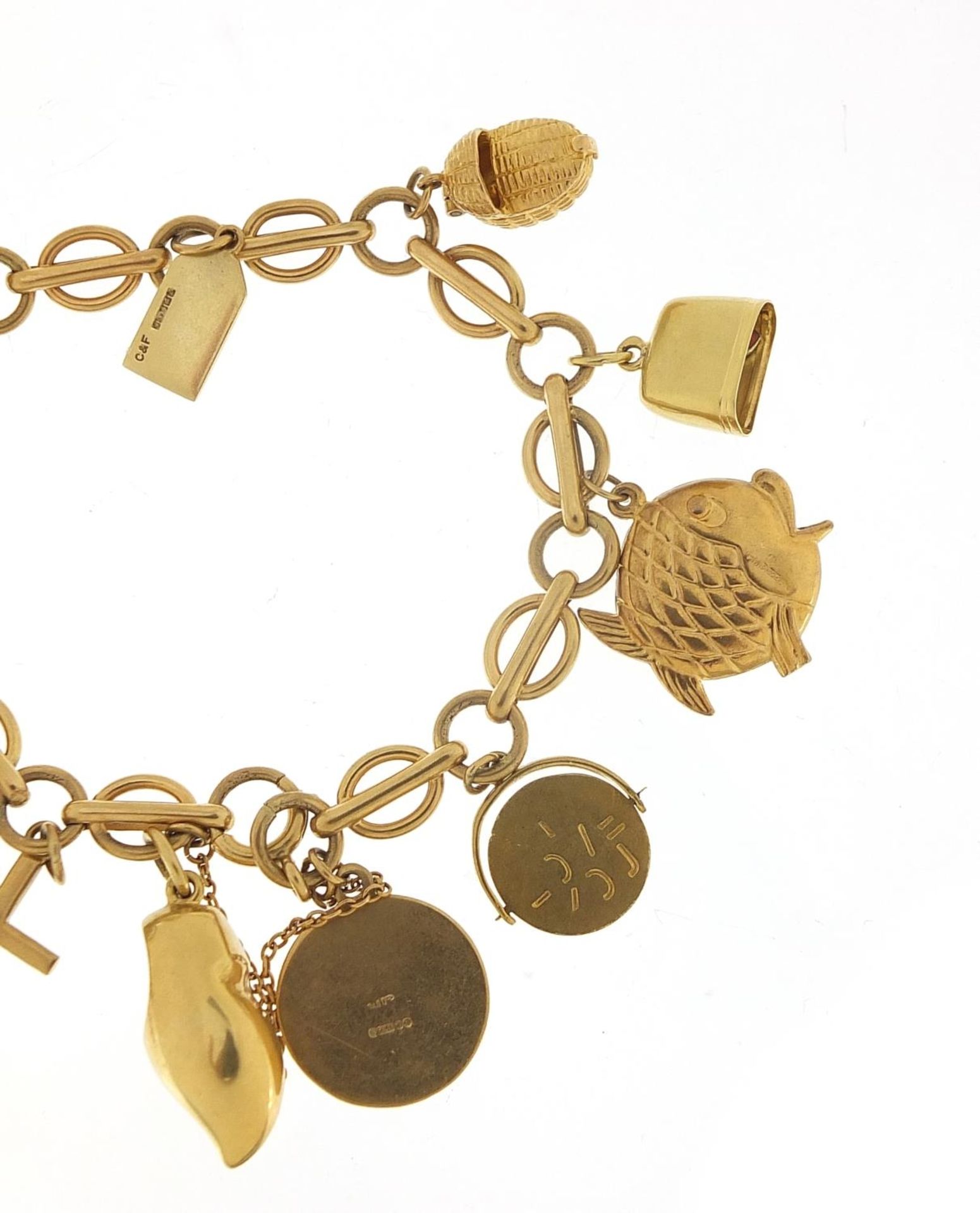 9ct gold charm bracelet with a selection of mostly gold charms including St Christopher, Dutch - Image 6 of 8