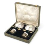 Olympic interest pair of silver cups and saucers with teaspoons, previously owned by George Nicol,