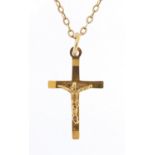 9ct gold crucifix pendant on a 9ct gold necklace, 2.2cm high and 40cm in length, total 2.7g : For