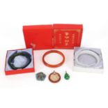 Chinese jewellery including green agate bangle, white nephrite bangle, red agate bangle and a silver