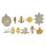 Twelve British military Staybright cap badges including military Provost Staff Corps and