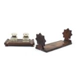Jerusalem olive wood extending book slide and an oak desk stand with two cut glass inkwells, the