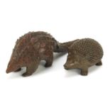 Two Japanese patinated bronze okimonos comprising hedgehog and armadillo, one with character