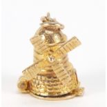 9ct gold windmill charm opening to reveal a mill worker, 1.5cm high, 2.7g : For Further Condition