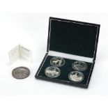 Set of four Chinese yuan silver coins and a two ounce Fifth Anniversary Founding of Shanghai Stock