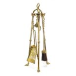 Edwardian brass four piece fire companion set with paw feet, 62cm high : For Further Condition