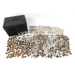 Collection of British and world coinage arranged in a black metal tin including some pre 1947, two