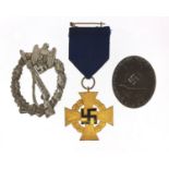 Three German military interest badges including a Wounds badge : For Further Condition Reports