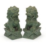 Pair of Chinese carved green stone dogs of Foo, each 15cm high : For Further Condition Reports