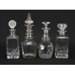Four Georgian and later cut glass decanters, the largest 30.5cm high : For Further Condition Reports