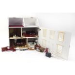 Large wooden doll's house with a large selection of mostly wooden furniture, the house 62cm H x 62cm