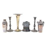 Silver plated items including two Art Deco cocktail shakers and a pair of candlesticks, the