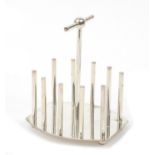 Modernist silver plated four slice toast rack in the manner of Christopher Dresser, 15cm high :