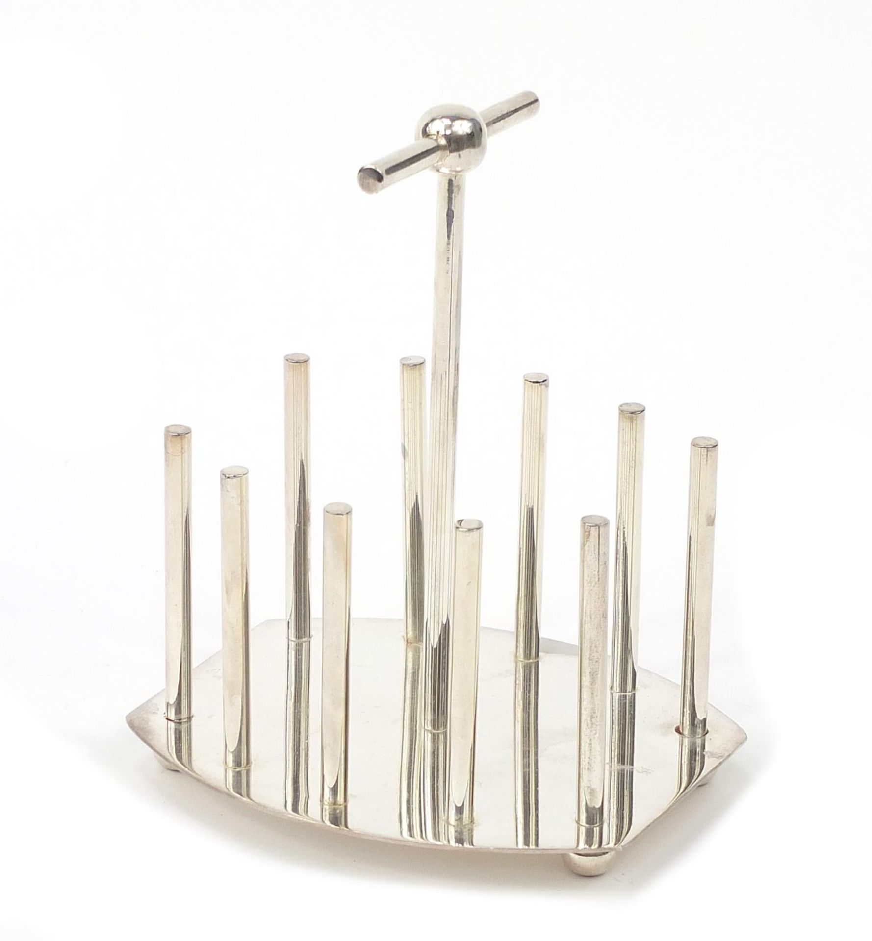 Modernist silver plated four slice toast rack in the manner of Christopher Dresser, 15cm high :