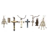 Silver and white metal jewellery including two crucifix pendants, filigree metal hand of Fatima