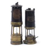 Two early 20th century miner's lamps including one by Ackroyd & Best numbered 699, the largest