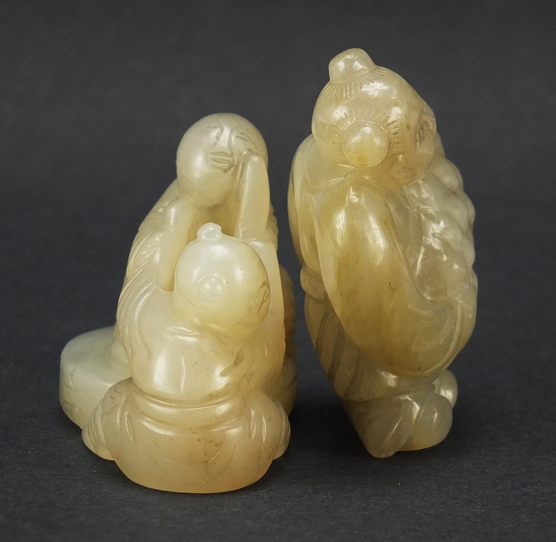 Two Chinese celadon and russet jade carvings including one of a figure holding fruit, the largest - Image 5 of 7
