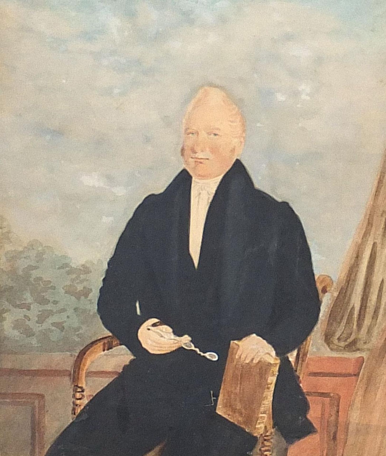 Three quarter length portrait of a seated gentleman holding spectacles, early 19th century