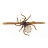 Unmarked gold spider bar brooch set with amethyst and mother of pearl, 5cm wide, 5.5g : For