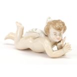 19th century Meissen style porcelain figure of Putti, 8.5cm in length : For Further Condition