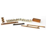 Sundry items including two rolling rules, whist marker and bone and ebony dominoes, the largest 46cm