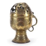 Middle Eastern copper burner with pierced lid and reticulated base engraved with flowers, 31cm