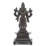 Indian patinated bronze votive figure of a deity, 21.5cm high : For Further Condition Reports Please