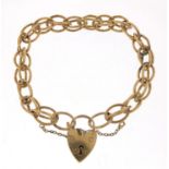 9ct gold charm bracelet with love heart padlock, 20cm in length, 24.0g : For Further Condition