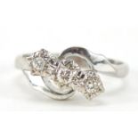 18ct white gold diamond three stone crossover ring, size M, 4.8g : For Further Condition Reports