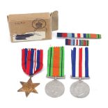 Three British military World War II medals and a box : For Further Condition Reports Please Visit
