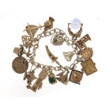 Silver charm bracelet with selection of charms including hedgehog, church, dagger and bible, 61.5g :