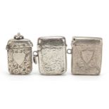 Three Victorian and later silver vestas with engraved decoration, Birmingham hallmarks, the